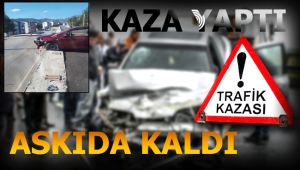 Kaza yapan otomobil askıda kaldı