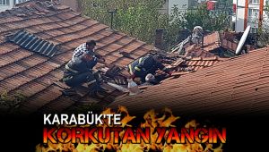 İtfaiye çatı kiremitlerini sökerek yangına müdahale etti