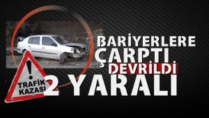 Bariyerlere çarpan otomobil devrildi: 2 yaralı