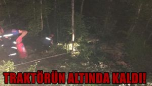 Devrilen traktörün altında kalan sürücü yaralandı
