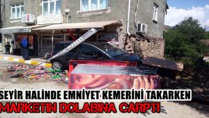 Seyir halinde emniyet kemerini takarken marketin dolabına çarptı