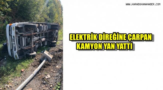 Elektrik direğine çarpan kamyon yan yattı