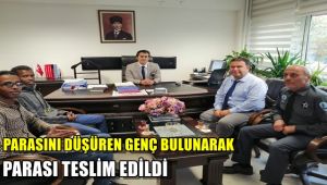 Parasını düşüren genç güvenlik kamerasından bulunarak parası teslim edildi