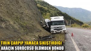 Tırın çarpıp yamaca sıkıştırdığı aracın sürücüsü ölümden döndü