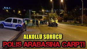 Alkollü sürücü polis arabasına çarptı