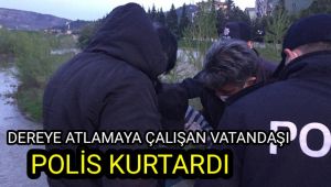 Dereye atlamaya çalışan şahsı polis kurtardı