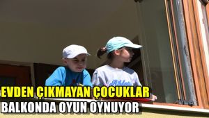 Evden çıkamayan çocuklar balkondan balkona oyun oynuyor
