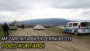 Mezarlıkta bileklerini kesti, polis kurtardı