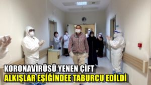 Korona virüsü yenen çift alkışlar eşliğinde taburcu edildi