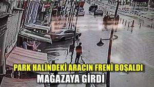 Park halindeki otomobilin freni boşalınca mağazaya girdi