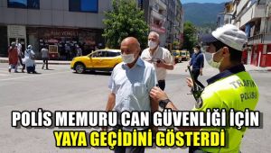 Polis memuru 'Can güvenliği' için yaya geçidini gösterdi
