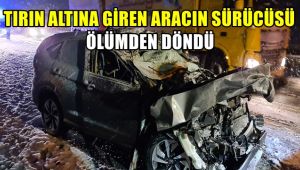 Tırın altına giren aracın sürücüsü ölümden döndü