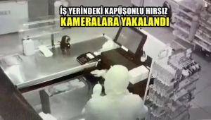 İş yerindeki kapüşonlu hırsız güvenlik kamerasına yakalandı