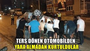 Ters dönen otomobilden yara almadan kurtuldular