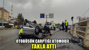 Otobüsün çarptığı otomobil takla attı