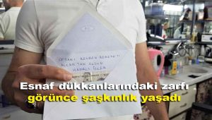 Esnaf dükkanlarındaki zarfı görünce şaşkınlık yaşadı