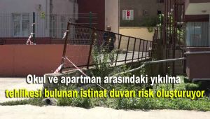 Okul ve apartman arasındaki yıkılma tehlikesi bulunan istinat duvarı risk oluşturuyor