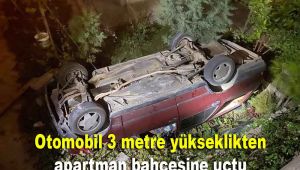 Kontrolden çıkan otomobil 3 metre yükseklikten apartman bahçesine devrildi