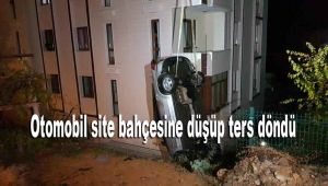 Otomobil site bahçesine düşüp ters döndü