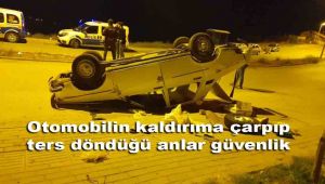 Otomobilin kaldırıma çarpıp ters döndüğü anlar güvenlik kamerasına yansıdı