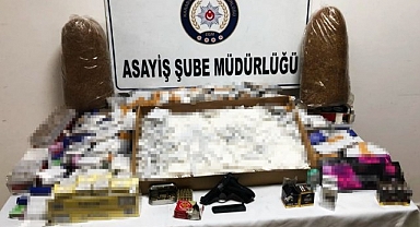 Karabük'te ruhsatsız silah ve bandrolsüz sigara ele geçirildi